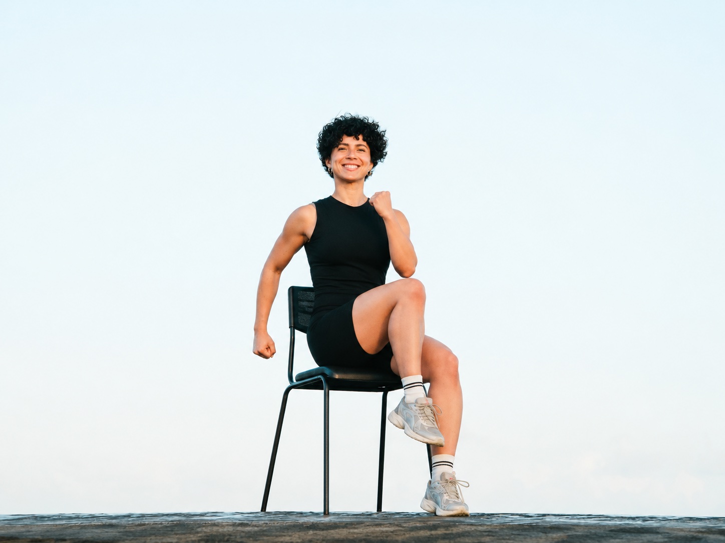 Laura Treto seated on a chair for Fit From Your Seat